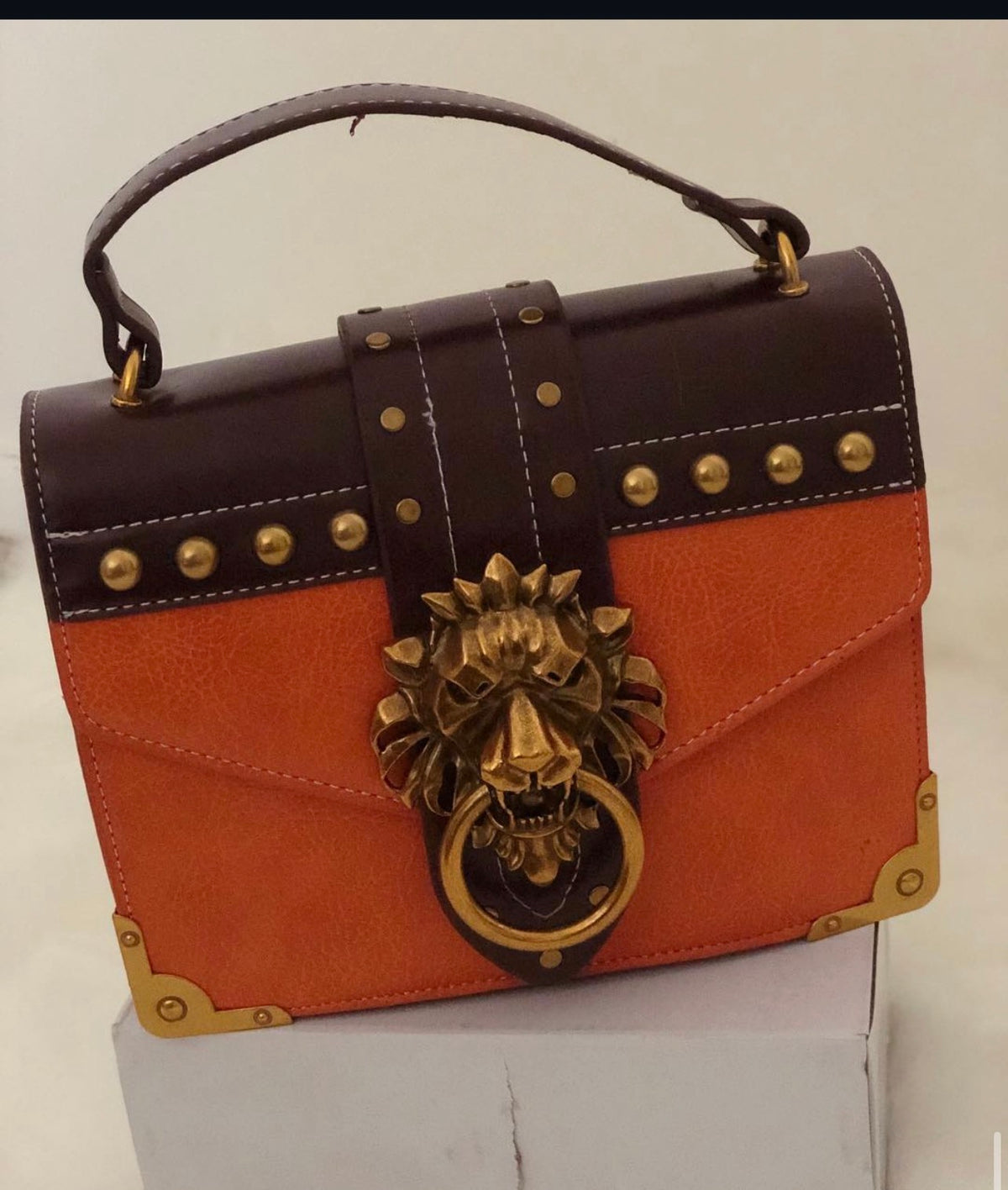 Gold Lion Emblem Handbag