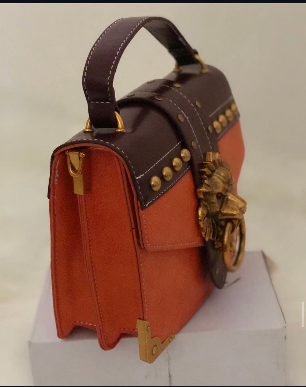 Gold Lion Emblem Handbag